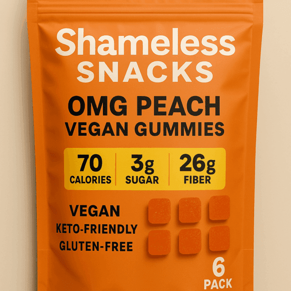 Shameless Snacks OMG Peach Vegan Gummies 6-pack in bright orange packaging with nutritional highlights: 70 calories, 3g sugar, 26g fiber; labeled vegan, keto-friendly, and gluten-free against a beige background.