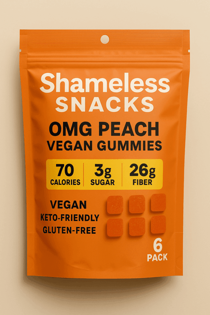 Shameless Snacks OMG Peach Vegan Gummies 6-pack in bright orange packaging with nutritional highlights: 70 calories, 3g sugar, 26g fiber; labeled vegan, keto-friendly, and gluten-free against a beige background.
