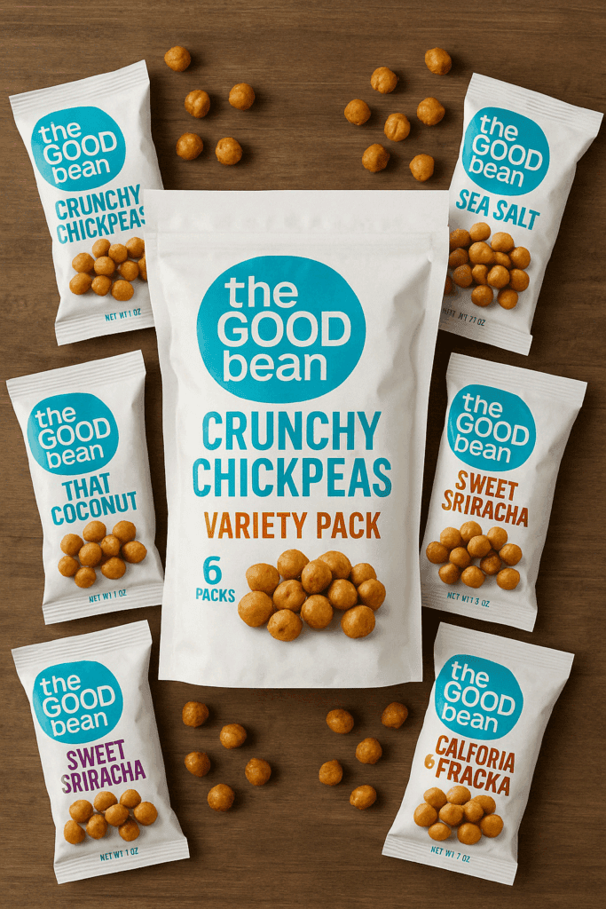 A variety pack of The Good Bean Crunchy Chickpeas on a wooden surface, surrounded by six colorful flavor bags and scattered roasted chickpeas.