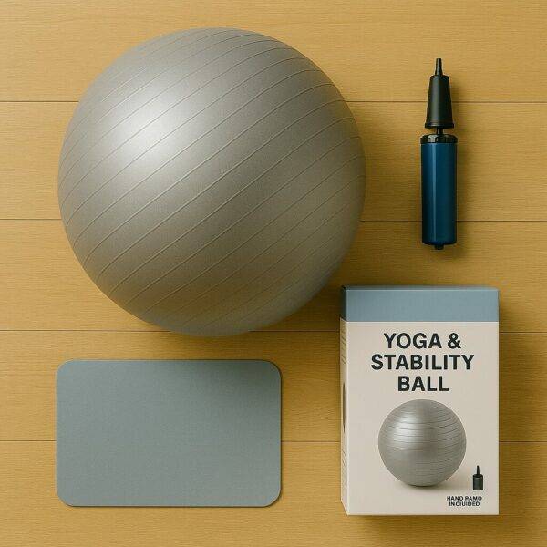 A silver-gray yoga and stability ball displayed on a wooden floor alongside a blue hand pump and a product box labeled "Yoga & Stability Ball," with a small blue mat adding visual balance.